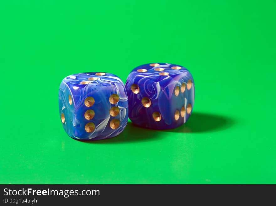 Two blue dices on green