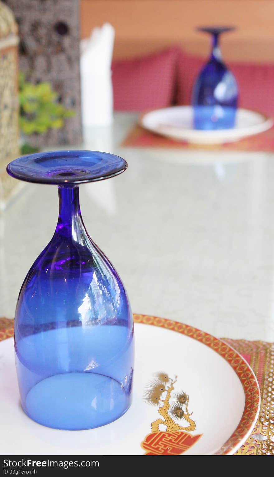 Blue colored glasses on a table setting