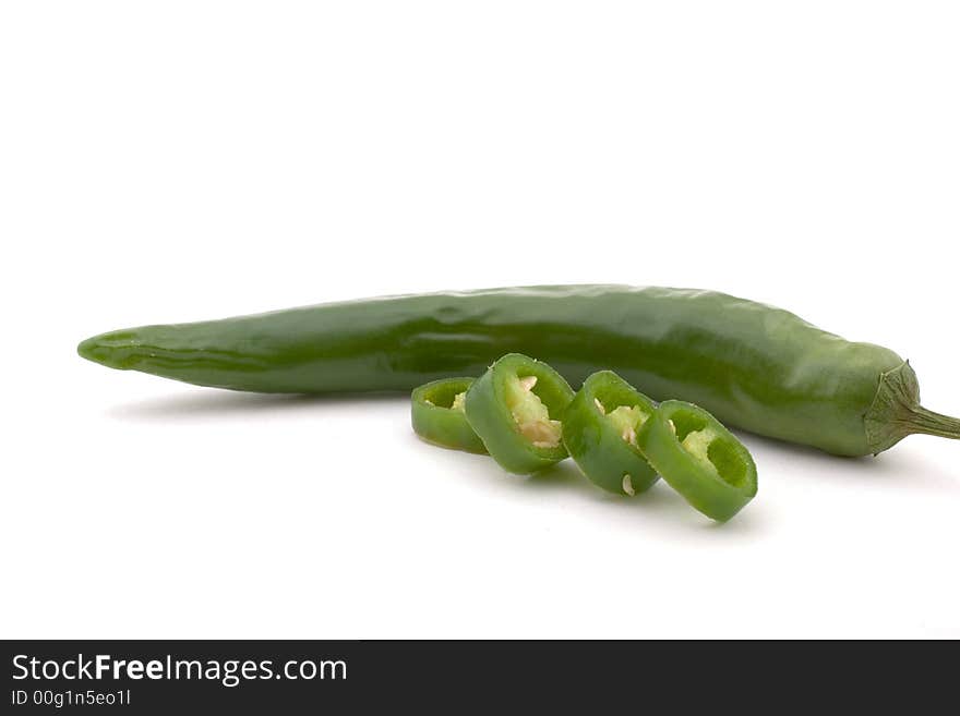 A green chili pepper, with 4 sliced pieces, isolated on white

<a href=http://www.dreamstime.com/search.php?srh_field=food&s_ph=y&s_il=y&s_sm=all&s_cf=1&s_st=wpo&s_catid=&s_cliid=301111&s_colid=&memorize_search=0&s_exc=&s_sp=&s_sl1=y&s_sl2=y&s_sl3=y&s_sl4=y&s_sl5=y&s_rsf=0&s_rst=7&s_clc=y&s_clm=y&s_orp=y&s_ors=y&s_orl=y&s_orw=y&x=29&y=15> See more food pictures.</a>
. A green chili pepper, with 4 sliced pieces, isolated on white

<a href=http://www.dreamstime.com/search.php?srh_field=food&s_ph=y&s_il=y&s_sm=all&s_cf=1&s_st=wpo&s_catid=&s_cliid=301111&s_colid=&memorize_search=0&s_exc=&s_sp=&s_sl1=y&s_sl2=y&s_sl3=y&s_sl4=y&s_sl5=y&s_rsf=0&s_rst=7&s_clc=y&s_clm=y&s_orp=y&s_ors=y&s_orl=y&s_orw=y&x=29&y=15> See more food pictures.</a>