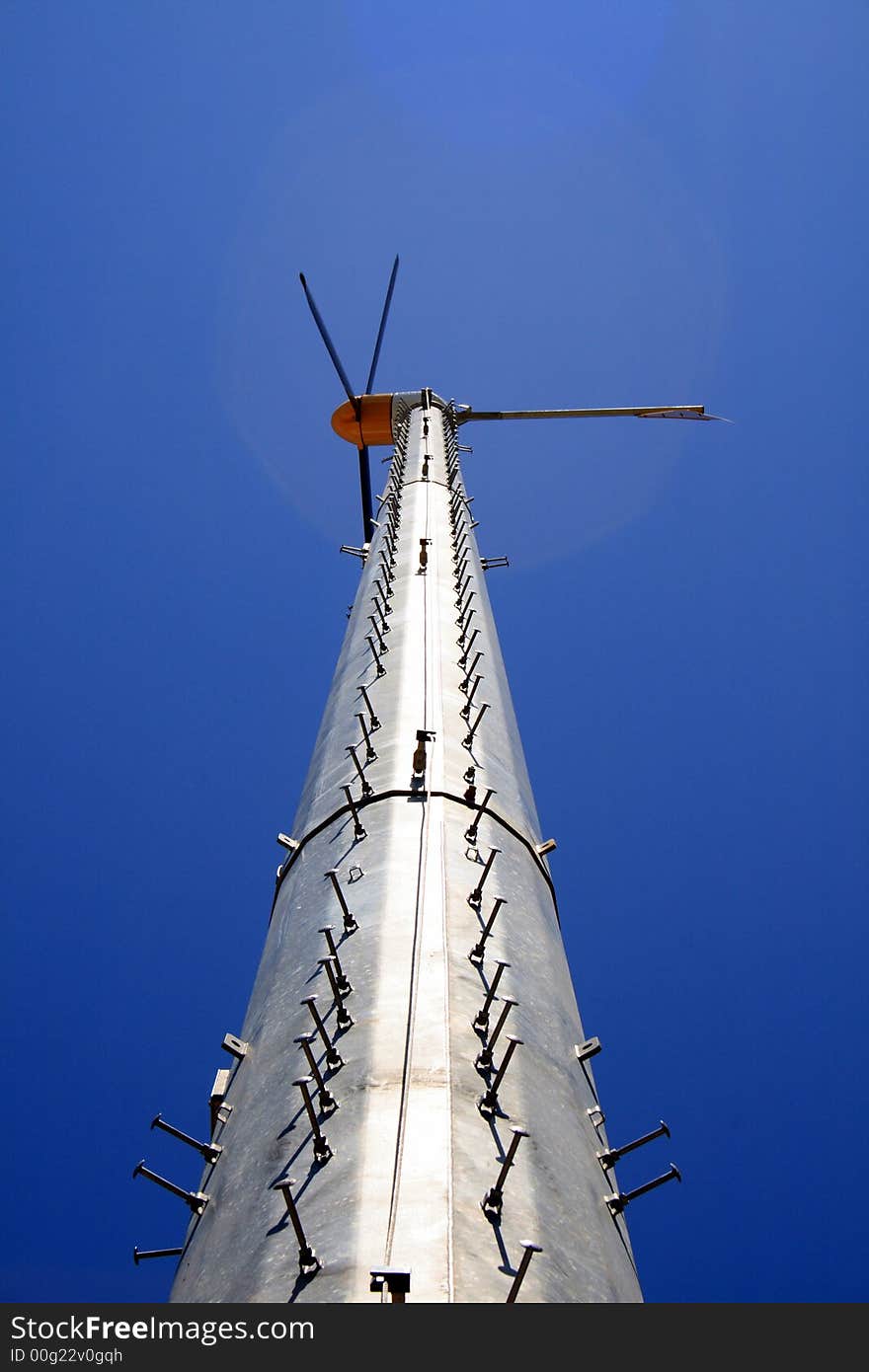 Wind turbine against a perfect blue sky