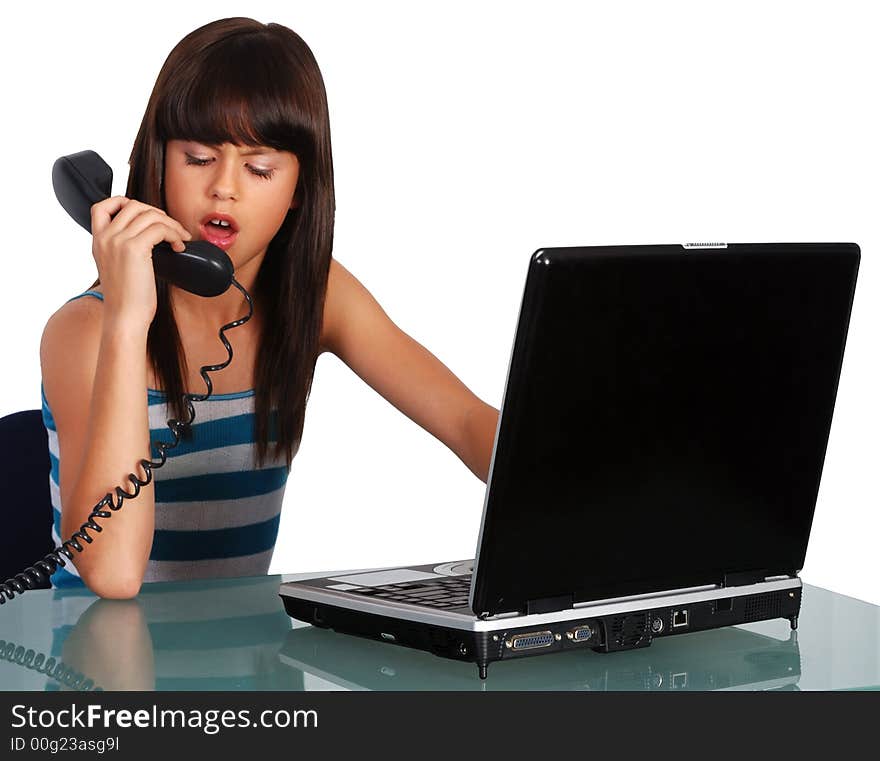 Young girl on phone with laptop. Young girl on phone with laptop