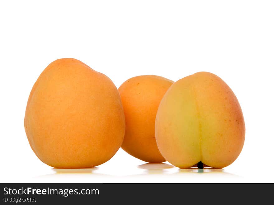 Apricots isolated over white background