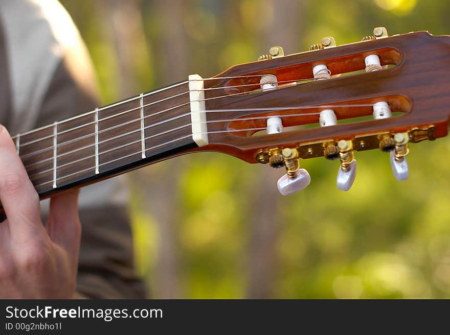 Signature stamp of a guitar and the person playing on it. Signature stamp of a guitar and the person playing on it