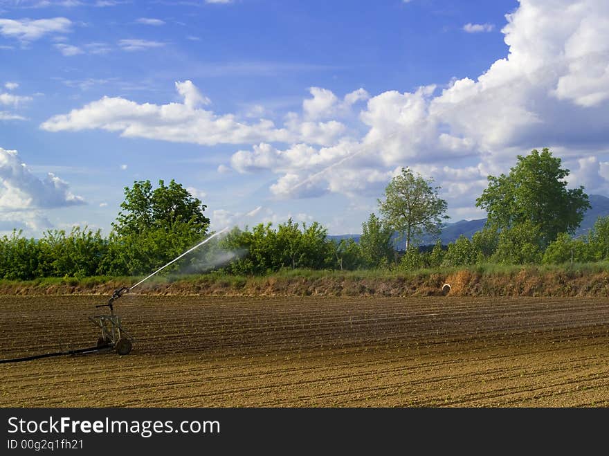 An hydrant irrigate a field in Umbria, Itlaly. An hydrant irrigate a field in Umbria, Itlaly.