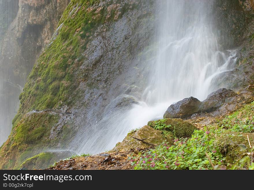 Water stream under the waterfall