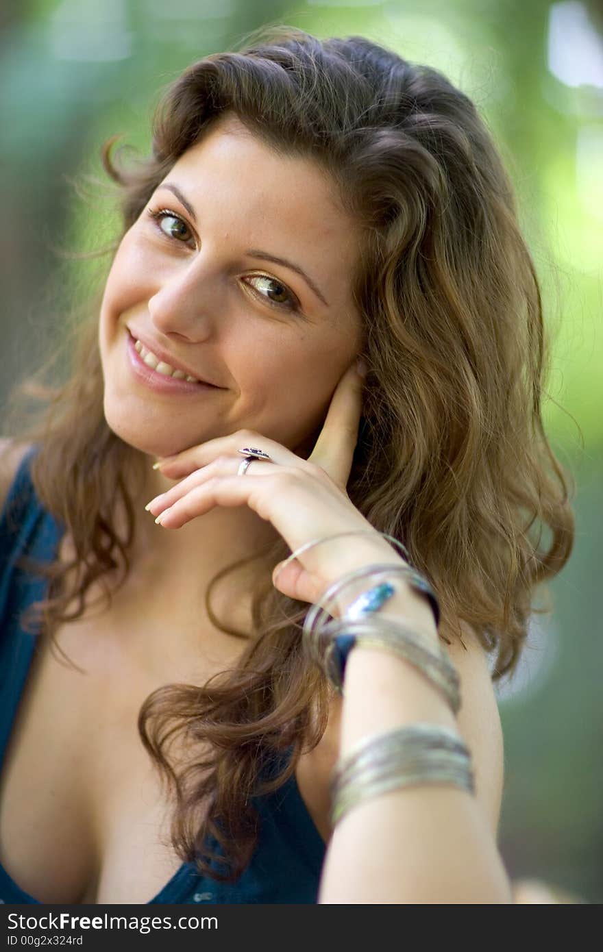 Beautiful woman sitting on a seat at park. Beautiful woman sitting on a seat at park