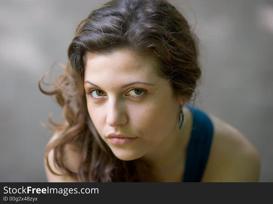 Beautiful woman sitting on a seat at park. Beautiful woman sitting on a seat at park