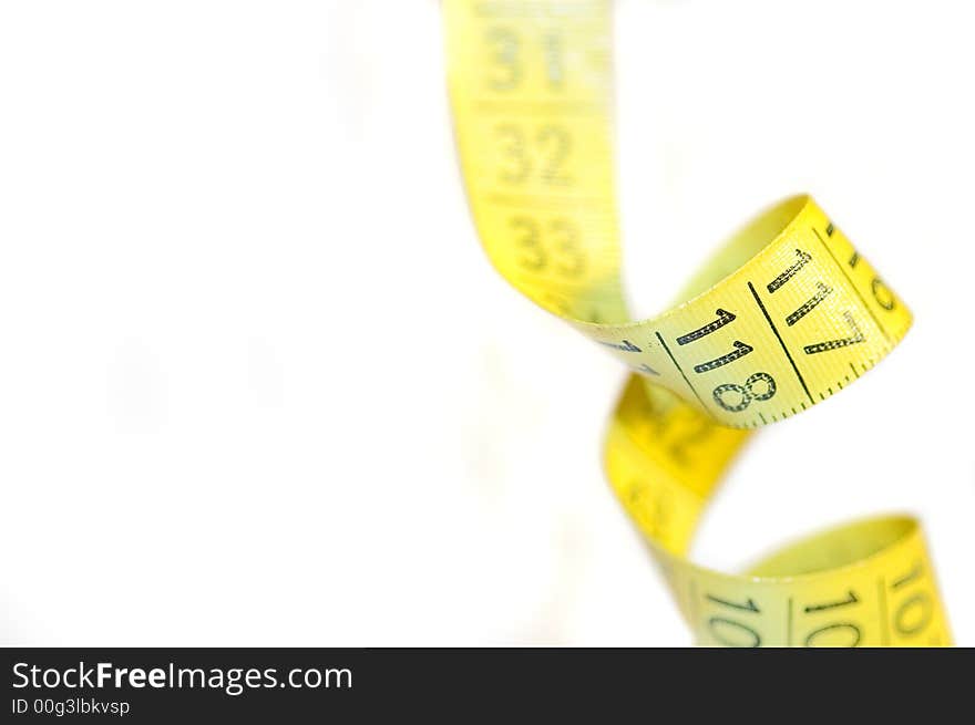 A yellow centimeter measure on white background