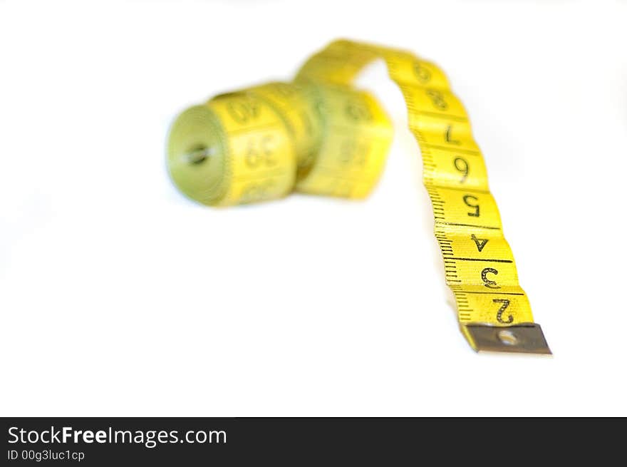 A yellow centimeter measure on white background