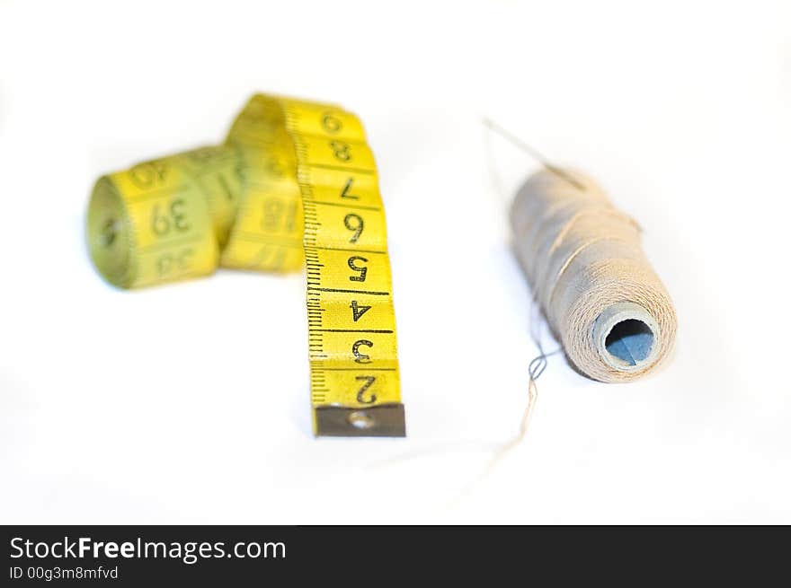 A yellow centimeter measure on white background