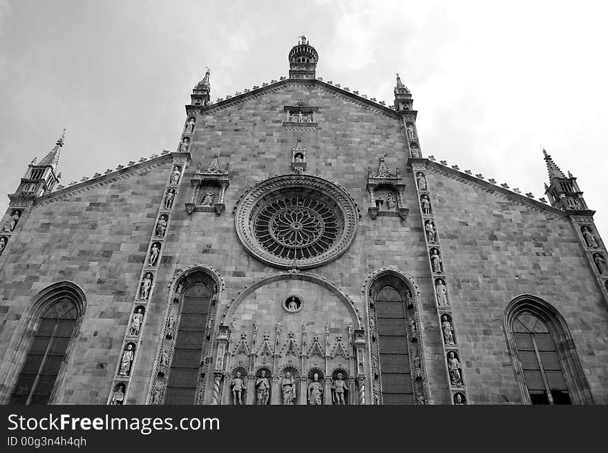 Photograph of the facade of the marble cathedral of the town of Como in Italie. Photograph of the facade of the marble cathedral of the town of Como in Italie.