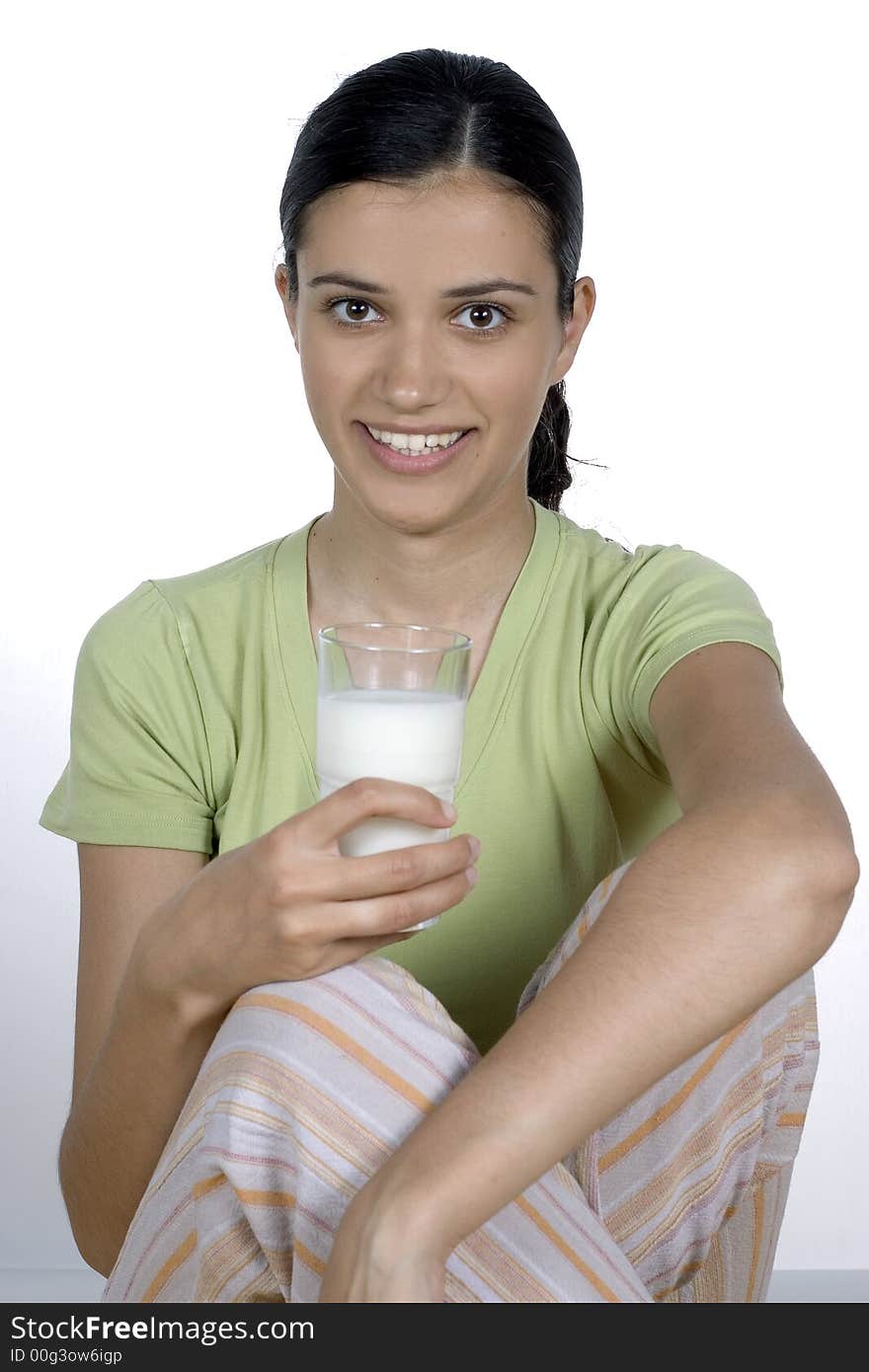 Girl holding glass with milk. Girl holding glass with milk