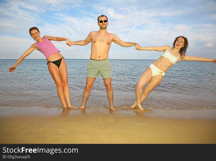 Man and girls about the sea