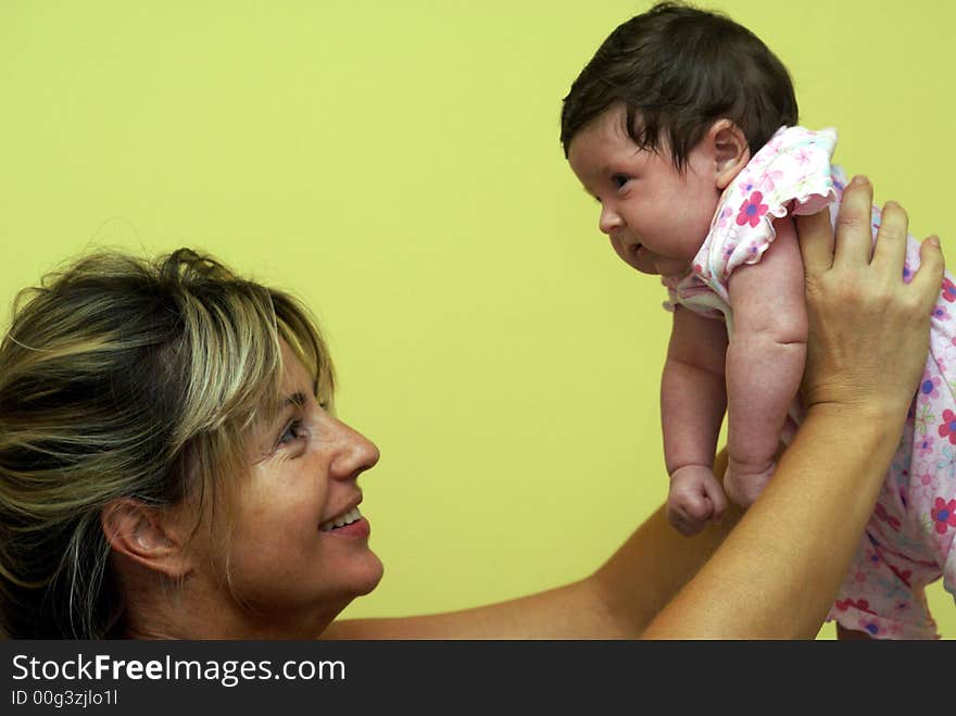 Young mother holding her baby girl. Young mother holding her baby girl