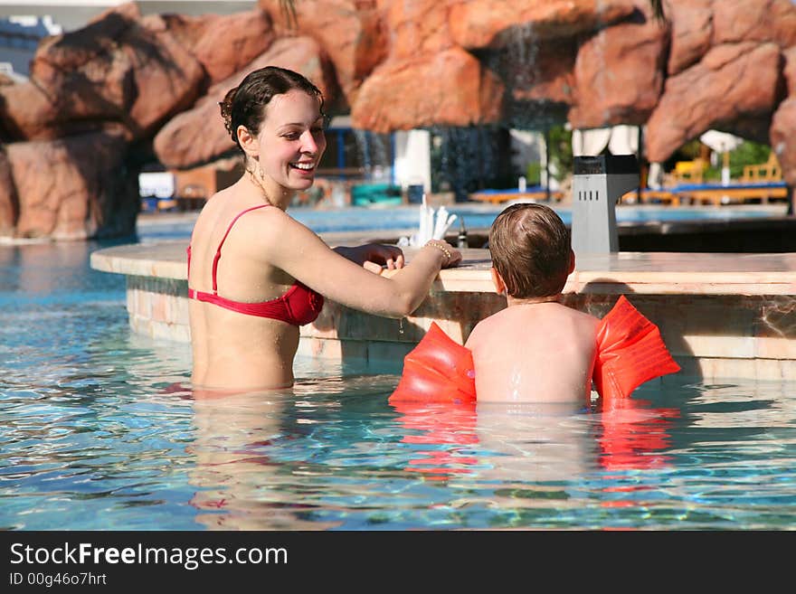 Mother with son at pool