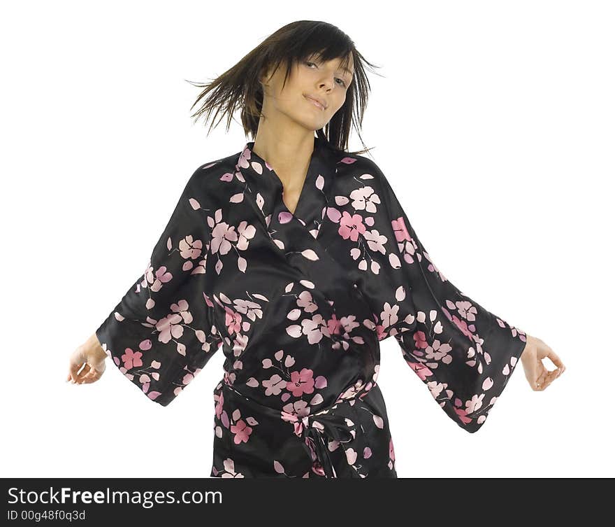 Young, sexy woman wearing bathrobe. Standing front, with arms wide open. Lookin at camera. Isolated on white in studio