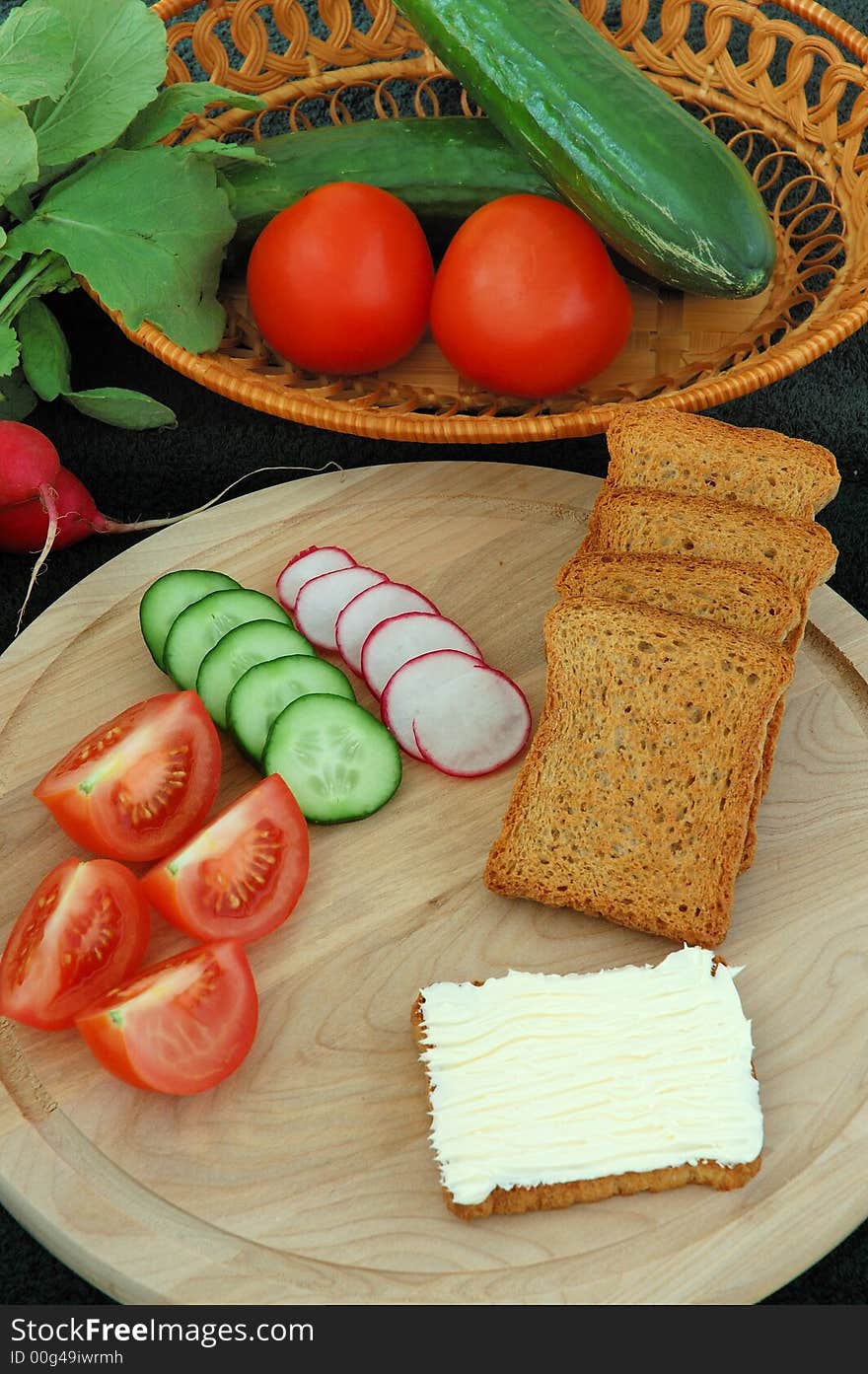 Diet cracker with butter and vegetables on the table. Diet cracker with butter and vegetables on the table.