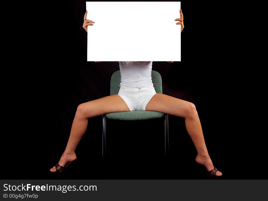 Isolated girl on chair with white paper in her hand