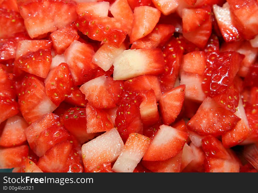 Several cut strawberries for background