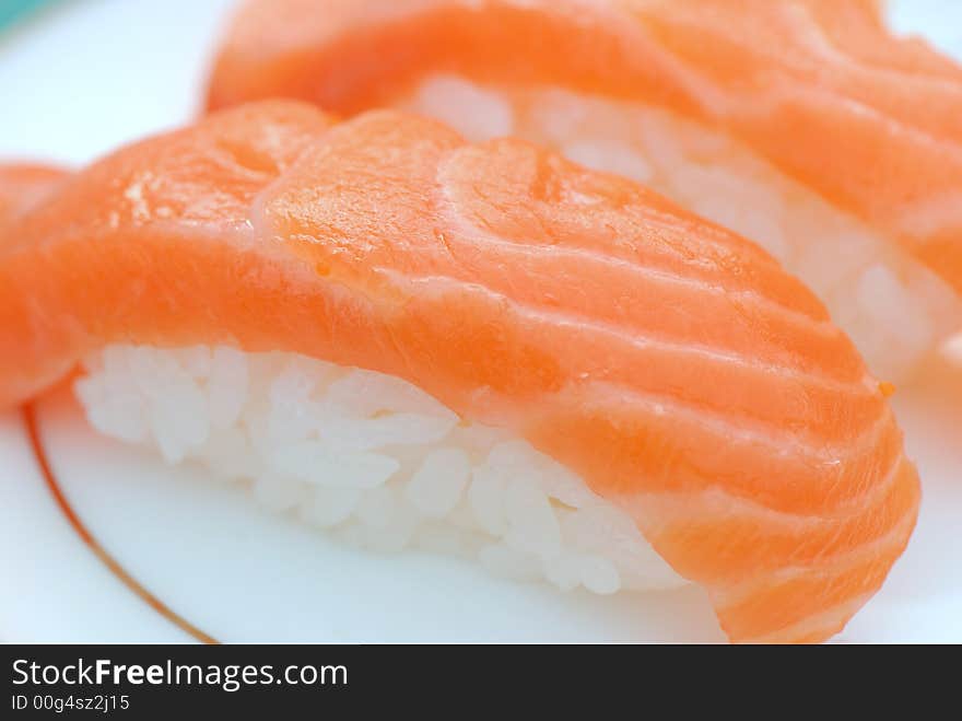 Salmon Rolls on a white plate. Salmon Rolls on a white plate