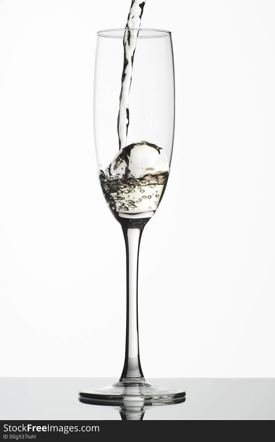 White wine being poured into a glass