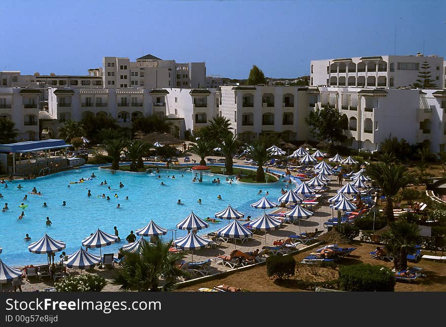 Summer time and some tunisian hotel with beautiful swimming pool