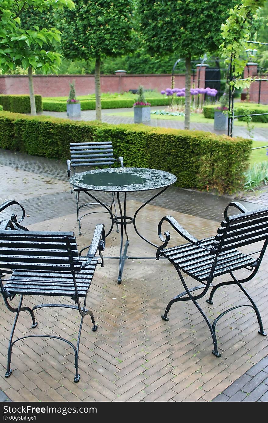 Wet furniture in park cafe after rain. Wet furniture in park cafe after rain