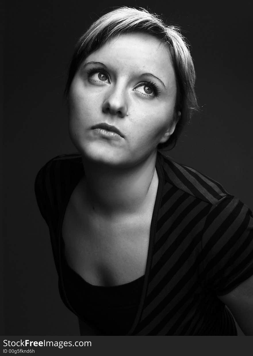 Woman on the black background.