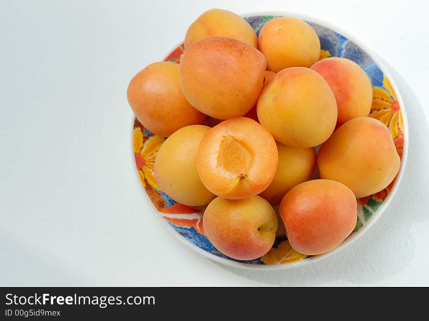 Apricots In Plate On White