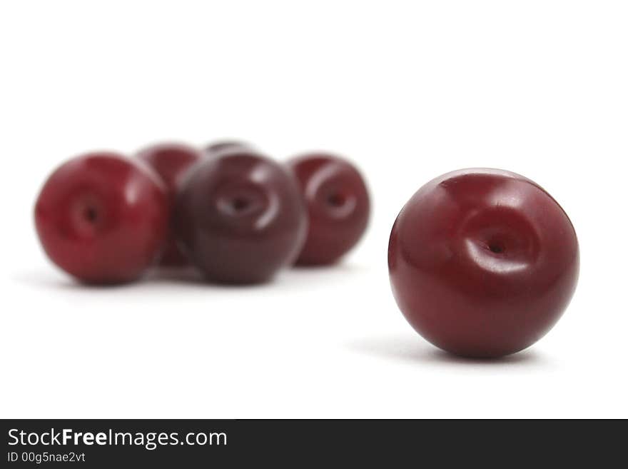 Red plums with white background