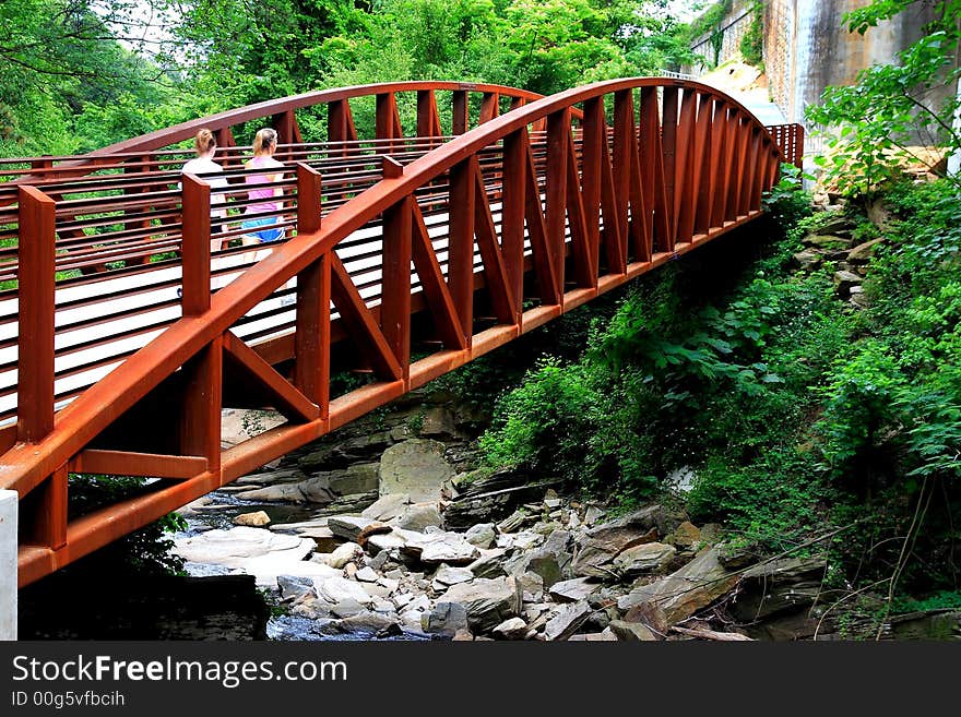 Walking Path lead to a bridge that crosses a creek. Walking Path lead to a bridge that crosses a creek