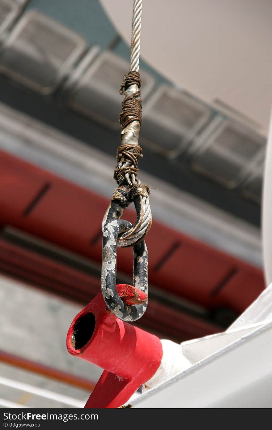 A closeup of a colorful piece of hardware on a ship. A closeup of a colorful piece of hardware on a ship