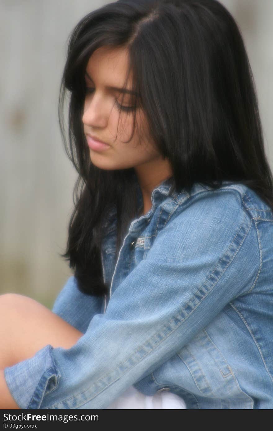 Girl outdoors on a spring day quietly reflecting on life. Girl outdoors on a spring day quietly reflecting on life