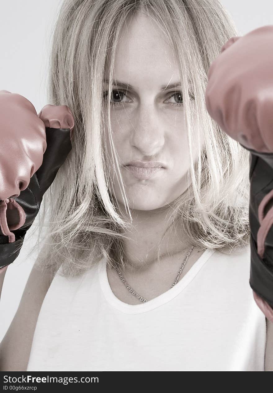 Blond female boxer with red boxing glowes