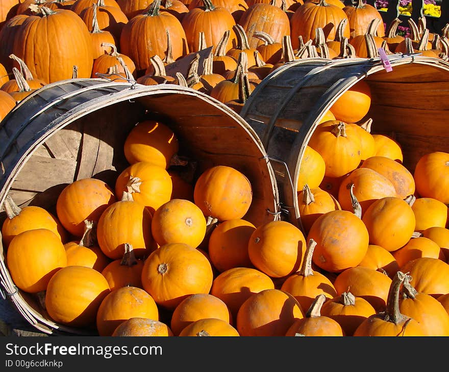 Pumpkin baskets at a New England farm stand in autumn. Pumpkin baskets at a New England farm stand in autumn