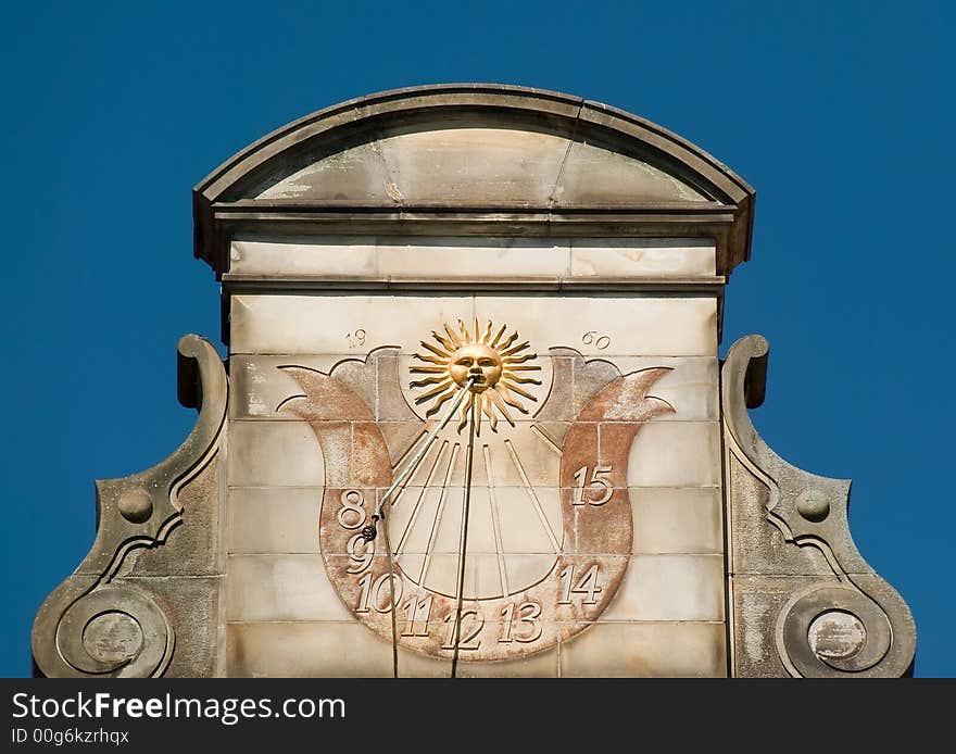 High noon on a sundial of a house at the Bremen market place in Germany. High noon on a sundial of a house at the Bremen market place in Germany