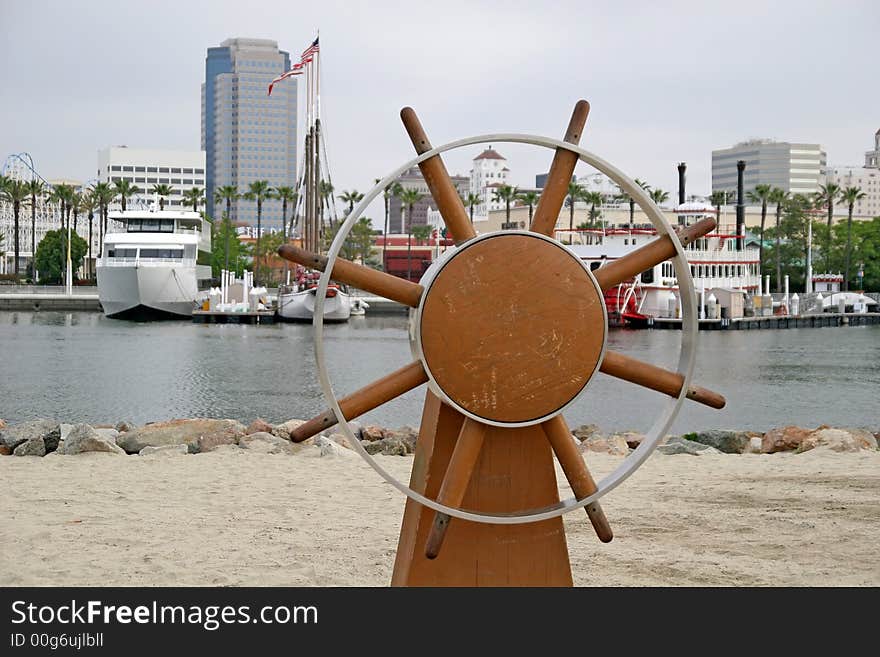 Ships Wheel On Beach