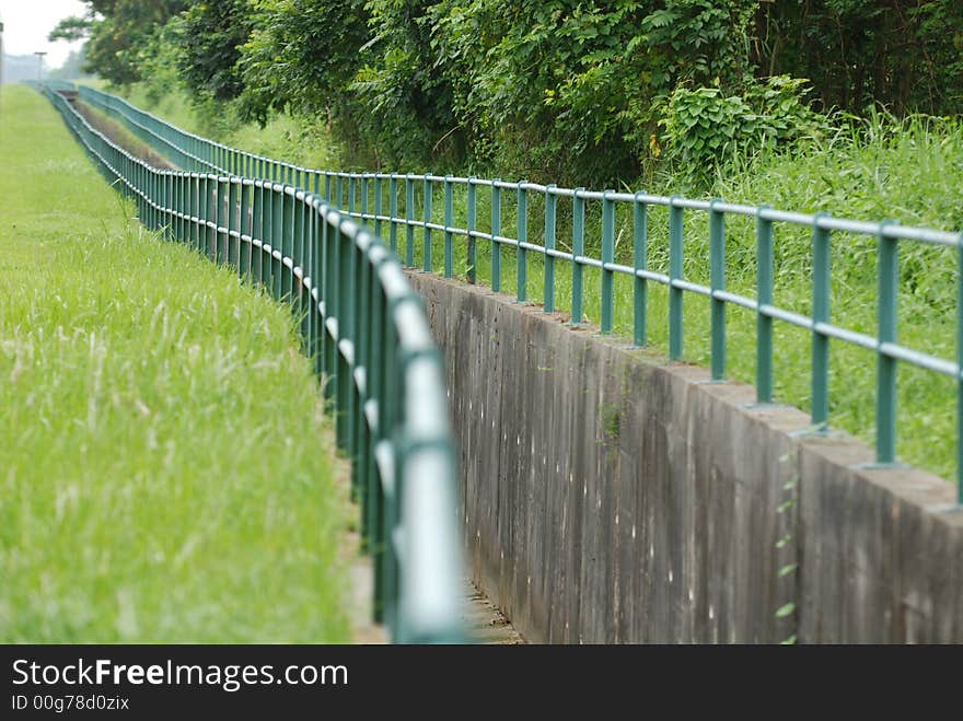 Big drain and fence  in the pa