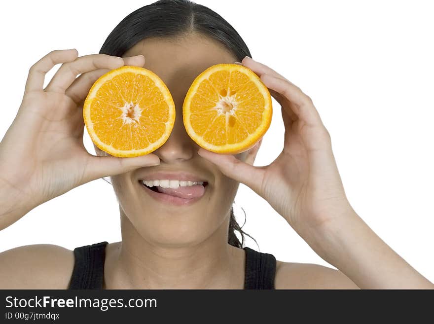 Isolated smiling girl holding orange in front of her eyes. Isolated smiling girl holding orange in front of her eyes