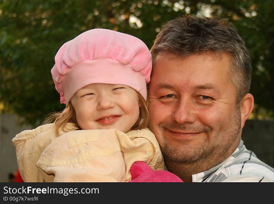 Smiling Father And Daughter