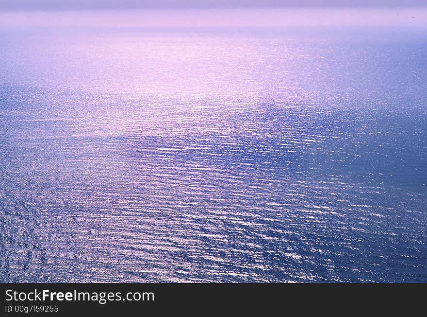 Surface of  sea of  sun covered by beams in  early morning. Surface of  sea of  sun covered by beams in  early morning