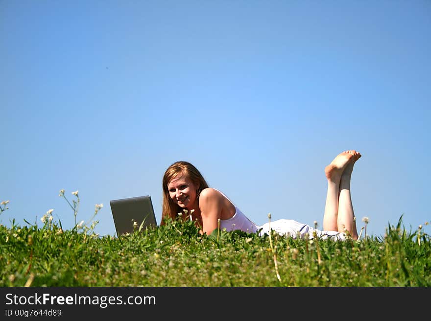 Student girl with notebook on grass. Student girl with notebook on grass