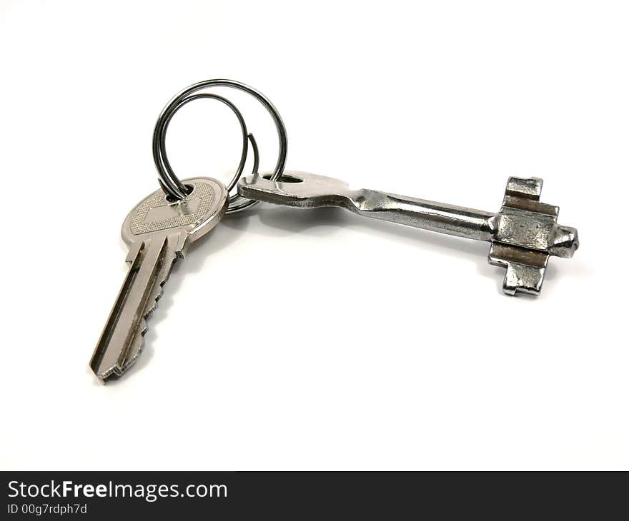 Keys from the house. It is partially visible on a picture and the second key which is connected to the first by ring.