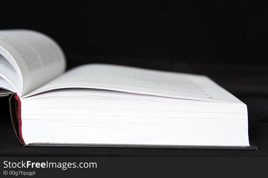 Open book on a black background