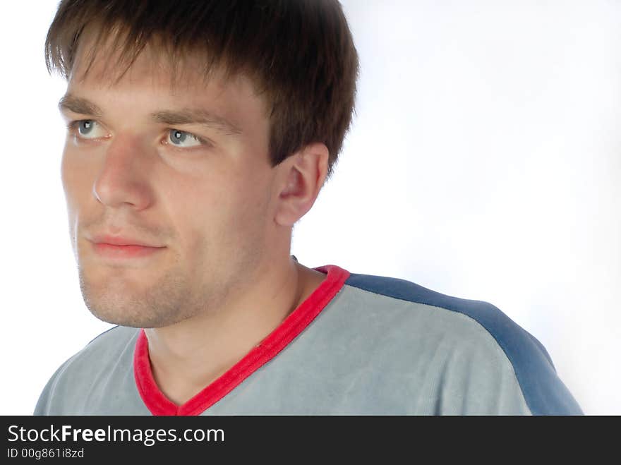 Portrait of  young guy which looks aside on  white background. Portrait of  young guy which looks aside on  white background