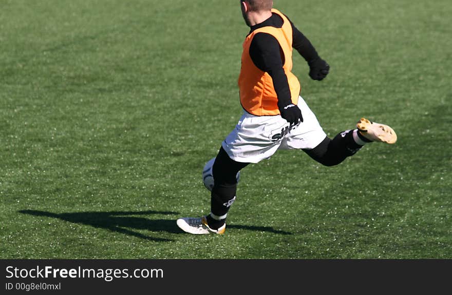 Striker on his way to kick the ball