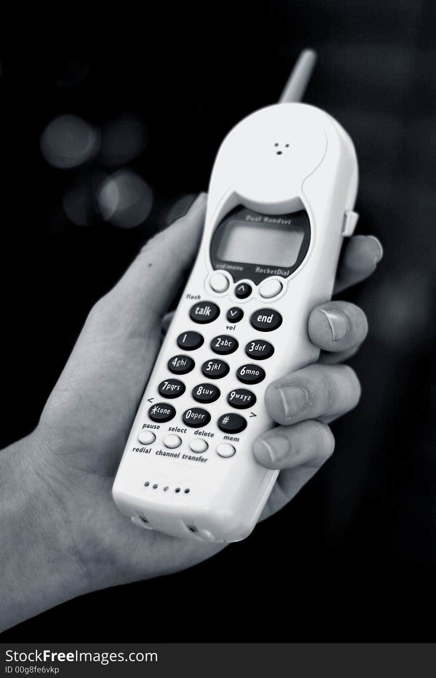 A phone, held by a male hand.