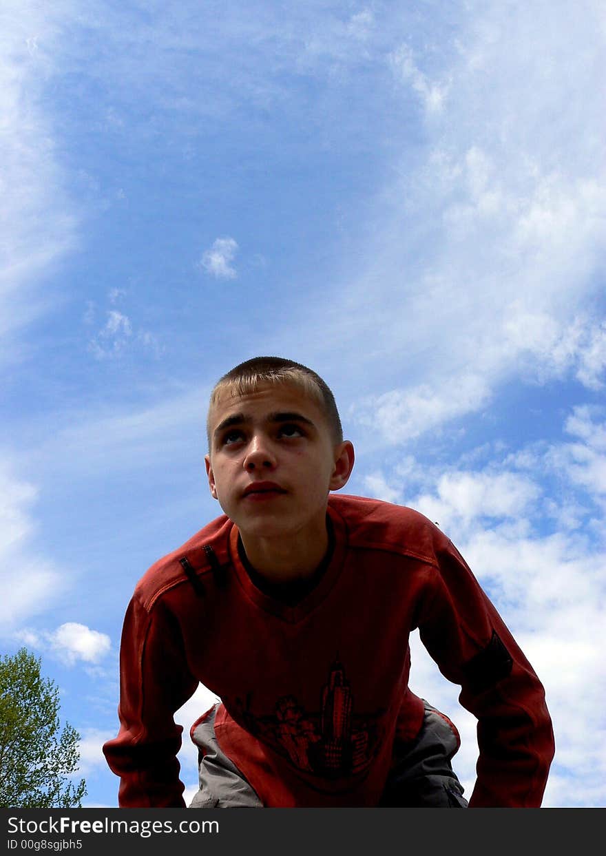 The boy is off-the shelf to catch a ball. The boy is off-the shelf to catch a ball