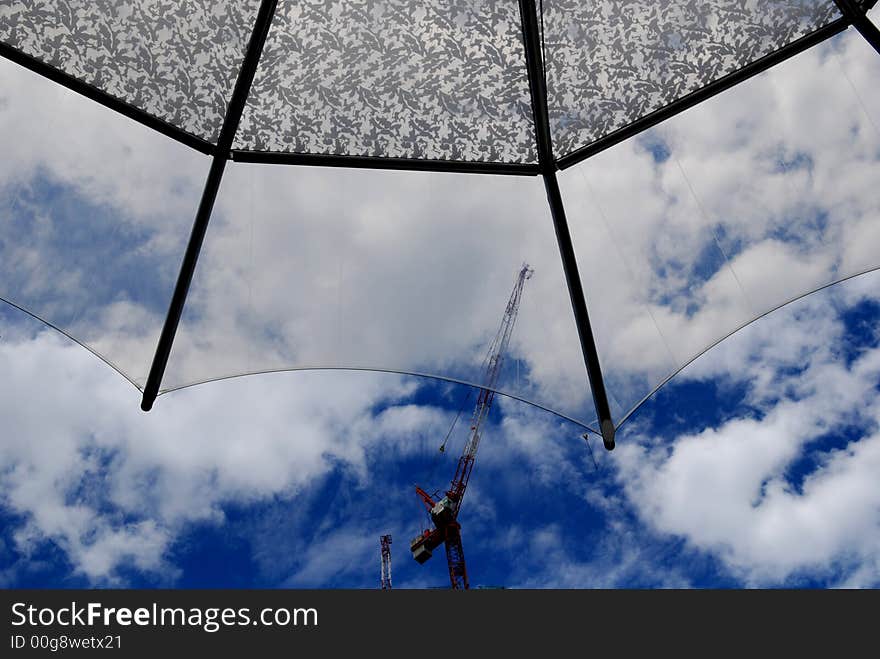 Glass tent and blue skies in the city