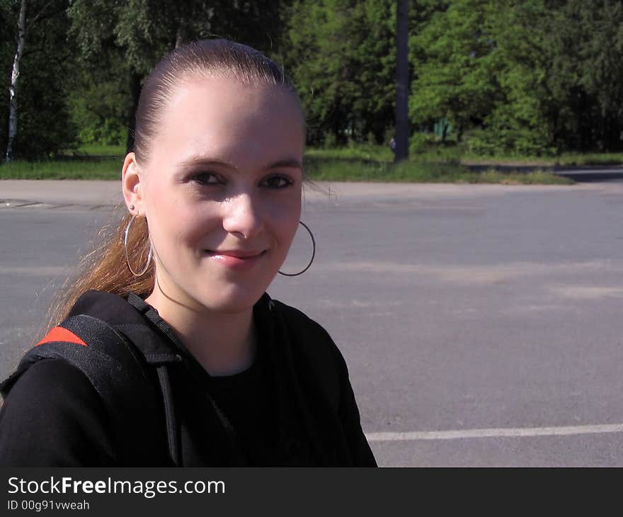 Young sports girl with backpack